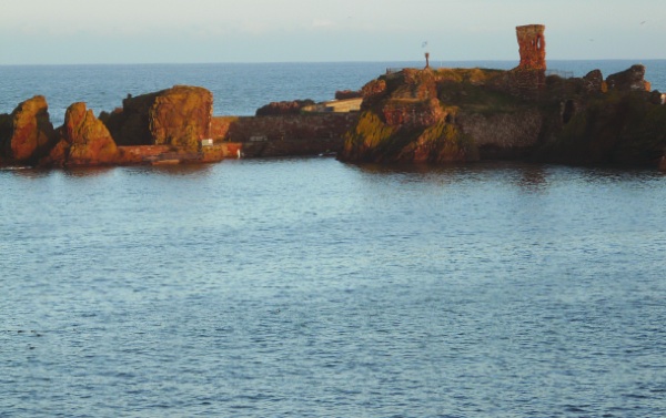 The remains of Dunbar Castle and Harbour - look carefully you can see the saltire flying.