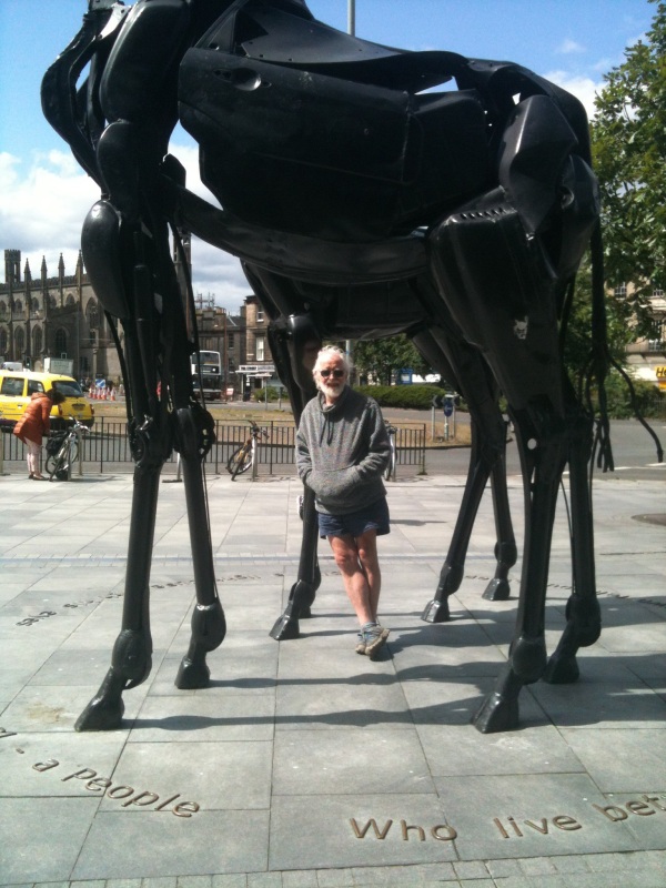 Posing beneath the full size metal giraffes in Edinburgh